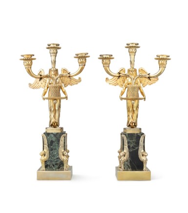 View full screen - View 1 of Lot 63. A pair of Queen Victoria Egyptian style three-light silver-gilt candelabra on marble base, Frederick Courthope, London, 1888 | Paire de chandeliers à trois lumières de style égyptien en vermeil sur socle en marbre par Frederick Courthope, Londres, 1888.