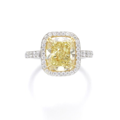 View full screen - View 1 of Lot 102. FANCY INTENSE YELLOW DIAMOND RING.
