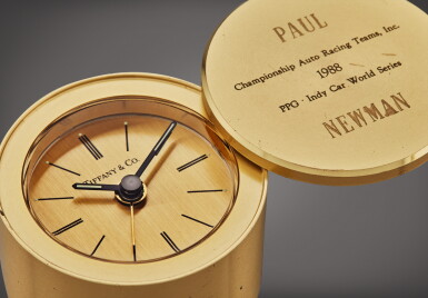 View full screen - View 1 of Lot 25. A gilt brass presentation timepiece with alarm inscribed to Paul Newman, Championship Auto Racing Teams, Inc. 1988 PPG Indy Car World Series.