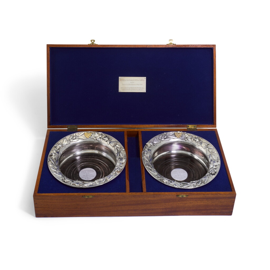 View full screen - View 1 of Lot 97. Eton College Interest | A pair of Elizabeth II parcel-gilt silver wine coasters , Elizabeth Matthews, London, 1991.