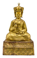 A LARGE GILT-COPPER REPOUSSÉ FIGURE OF PADMASAMBHAVA,TIBET, 17TH CENTURY | 十七世紀 藏傳鎏金銅錘疊蓮花生大師坐像
