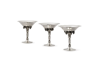 View full screen - View 1 of Lot 119. Three silver cups on foot, grape pattern, Jensen, Copenhagen, 20th century | Trois coupes sur pied en argent, modèle raisin, par Jensen, Copenhague, XXe siècle .