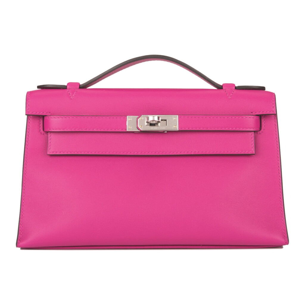 View full screen - View 1 of Lot 16. Hermès Rose Pourpre Mini Kelly Pochette of Swift Leather with Palladium Hardware.