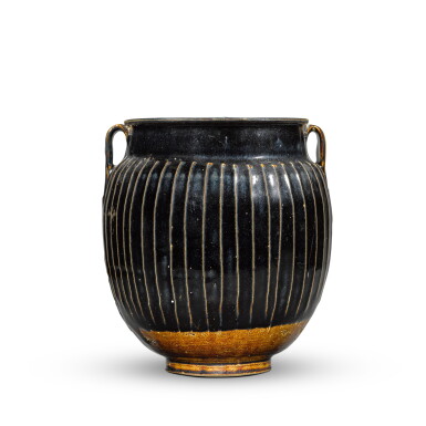 View full screen - View 1 of Lot 336. A Henan black-glazed ribbed jar, Northern Song dynasty | 北宋 黑釉棱線紋雙繫罐.