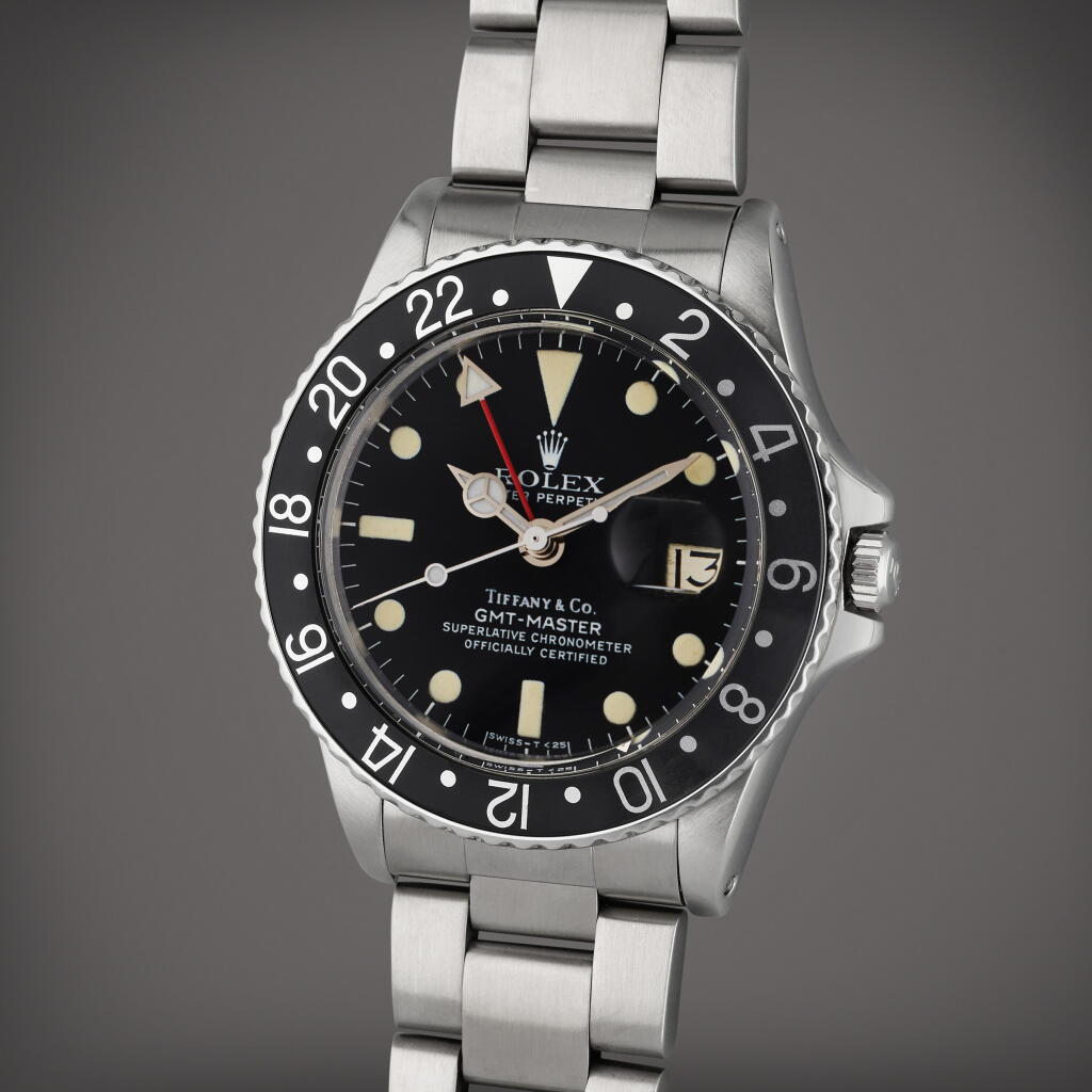 View full screen - View 1 of Lot 305. Reference 1675 GMT-Master | Retailed by Tiffany & Co.: A stainless steel automatic dual time wristwatch with date and bracelet, Circa 1977.