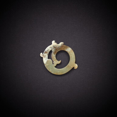 View full screen - View 1 of Lot 3515. A white jade 'chilong' ring, huan, Han dynasty | 漢 白玉螭龍紋環.