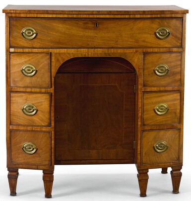 View full screen - View 1 of Lot 114. A GEORGE III BOXWOOD STRUNG AND CROSSBANDED MAHOGANY BOW-FRONT KNEEHOLE DESK, CIRCA 1780.