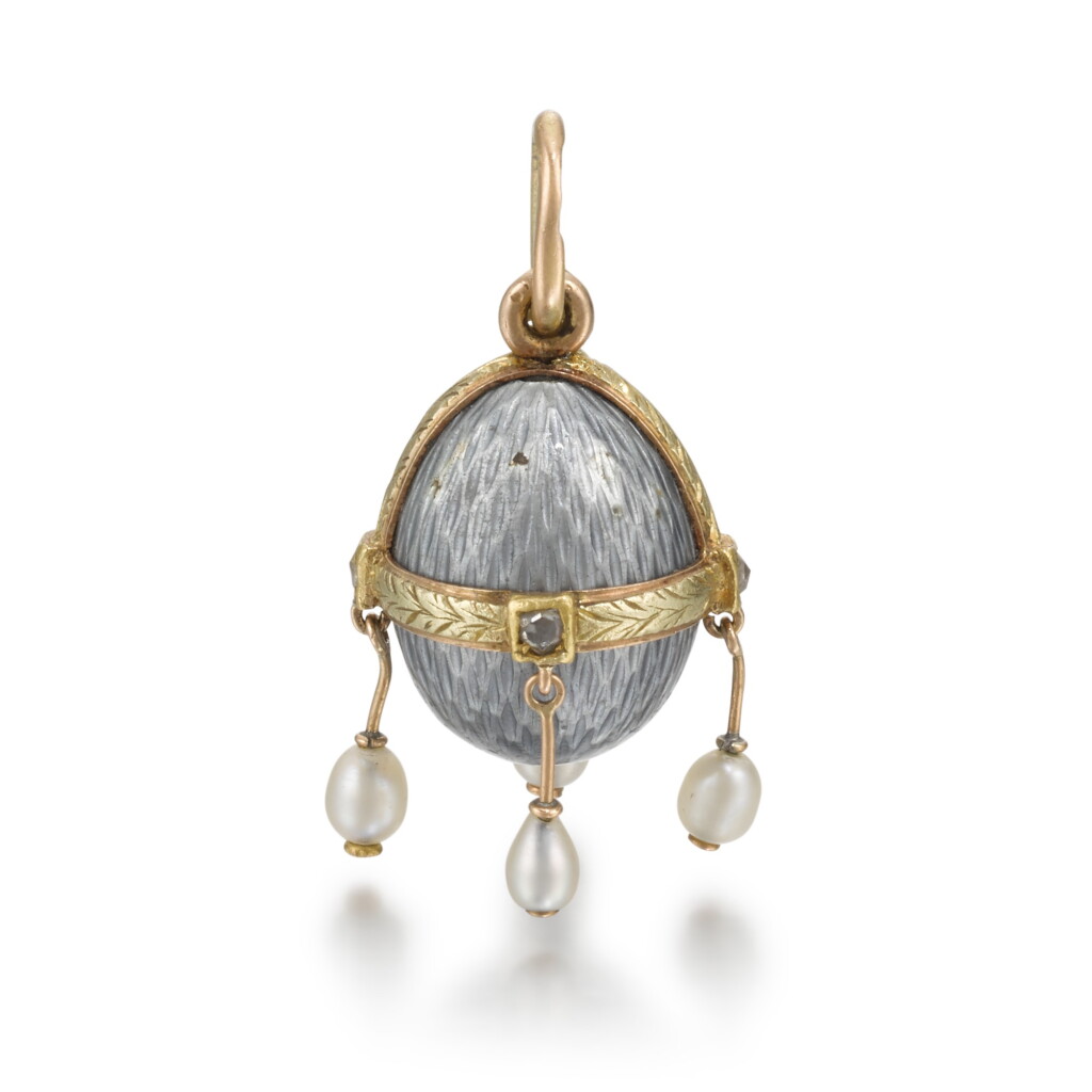 View full screen - View 1 of Lot 415. A Fabergé jewelled varicoloured gold and guilloché enamel egg pendant, workmaster Henrik Wigström, St Petersburg, circa 1900.