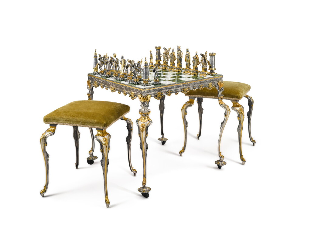 View full screen - View 1 of Lot 401. AN ITALIAN GILT AND SILVERED BRONZE "CRUSADES" CHESS SET, TABLE AND TWO STOOLS, GIUSEPPE VASARI, 20TH CENTURY.