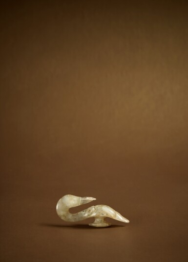 View full screen - View 1 of Lot 113. A small gray jade goose-head belt hook, Eastern Zhou dynasty .