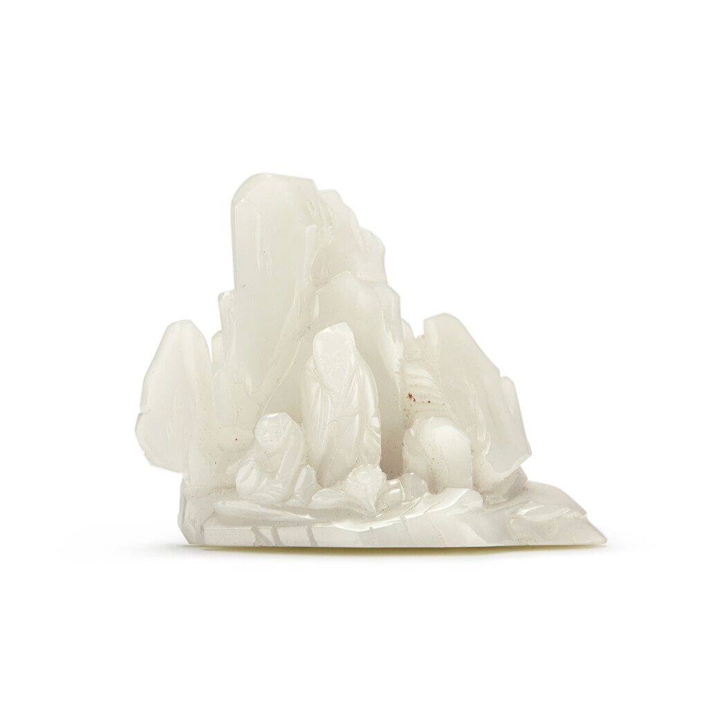 View full screen - View 1 of Lot 50. A pale green jade 'scholar and attendant' mountain-form brushrest, Qing dynasty, 19th century.