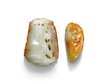 View full screen - View 1 of Lot 981. Two celadon and russet jade pendants, 19th / 20th century | 十九 / 二十世紀 玉雕珮飾一組兩件.