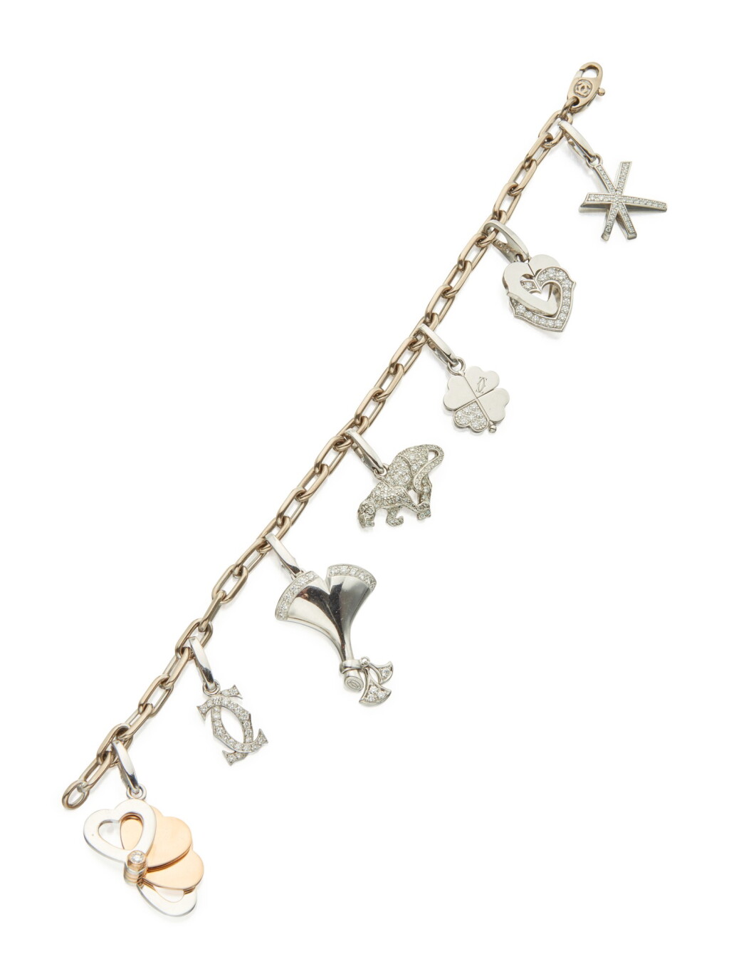 View full screen - View 1 of Lot 86. WHITE GOLD AND DIAMOND CHARM BRACELET, CARTIER.