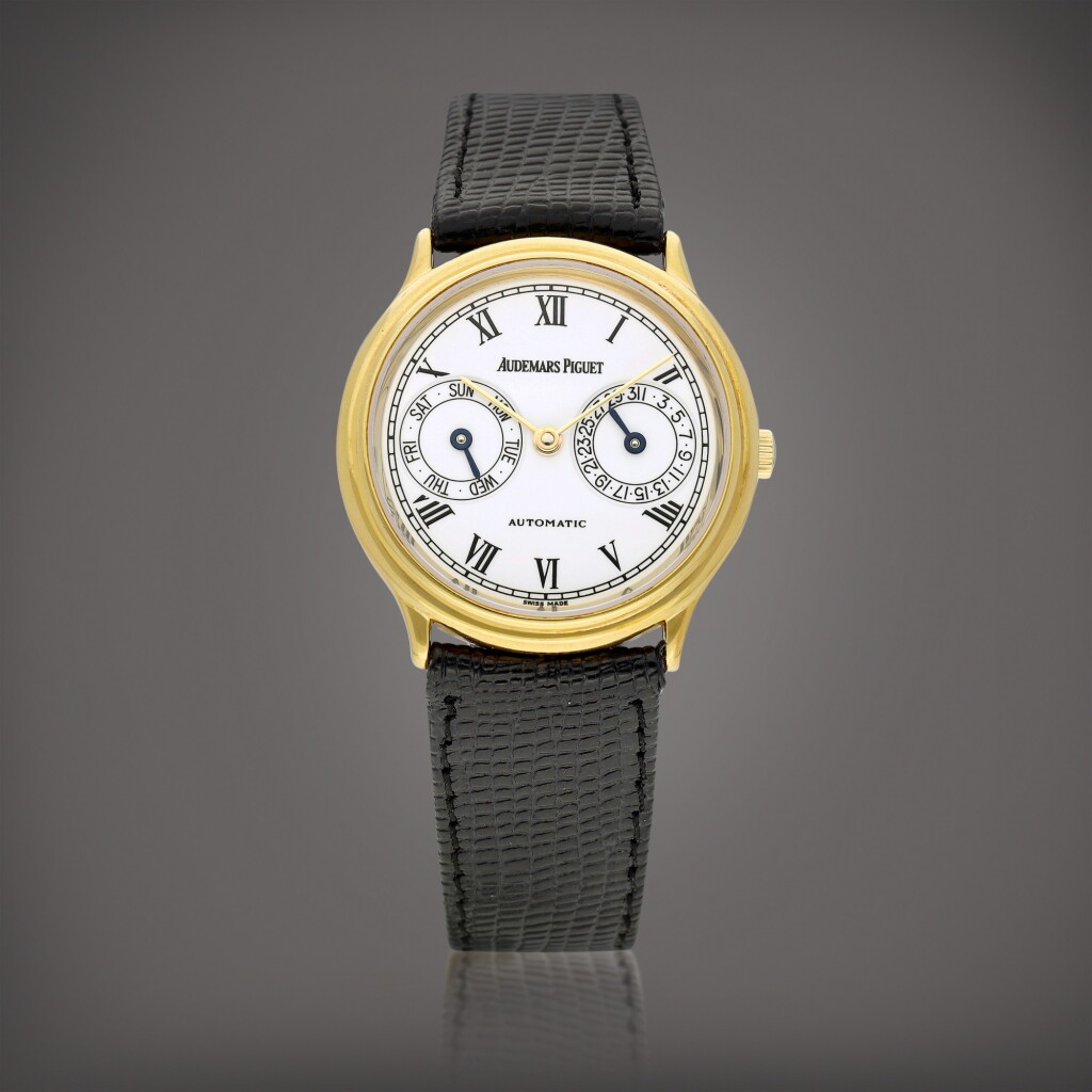 View full screen - View 1 of Lot 8702. Reference 25574BA | A yellow gold wristwatch with day, date and enamel dial, Circa 1984 | 愛彼 | 型號25574BA | 黃金腕錶,備日期、星期顯示及琺瑯錶盤,約1984年製.