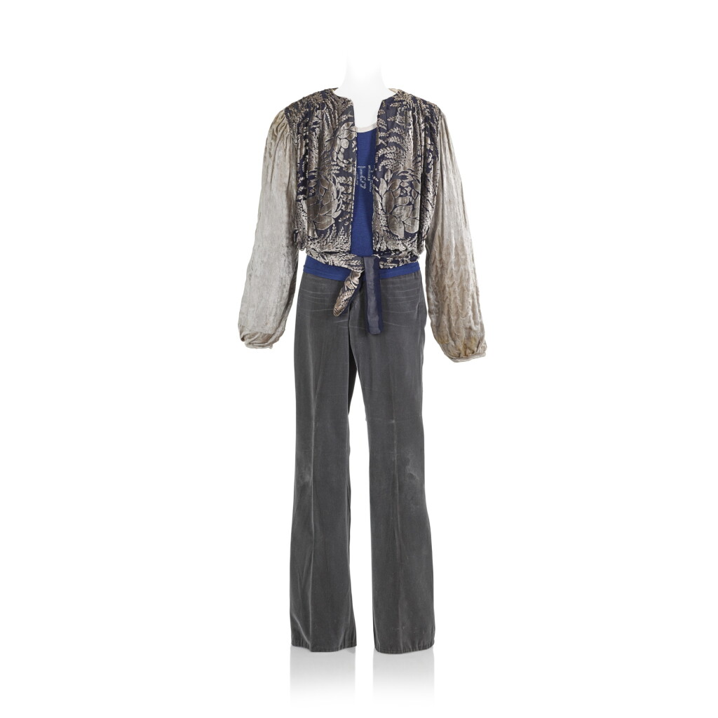 View full screen - View 1 of Lot 165. Freddie Mercury's publicity-worn blue and grey velvet jacket and vest, with a pair of flared trousers, worn 1975-76.