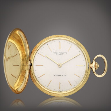 View full screen - View 1 of Lot 54. Retailed by Tiffany & Co.: A yellow gold hunting cased watch, Circa 1965.