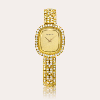 View full screen - View 1 of Lot 2104. A yellow gold and diamond-set bracelet watch, Circa 1975.