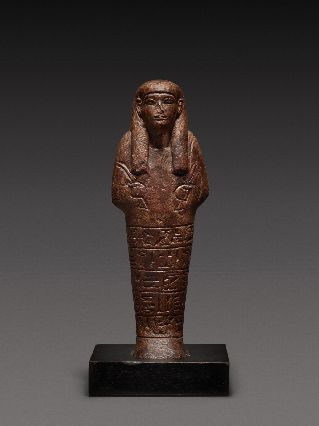 View full screen - View 1 of Lot 144. An Egyptian Sandstone Ushabti, 18th/early 19th Dynasty, circa 1540-1280 B.C..