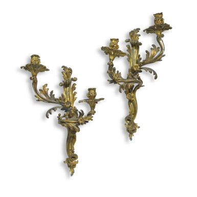 View full screen - View 1 of Lot 68. A pair of Louis XV style gilt-bronze two-light wall appliques, second quarter 19th century.