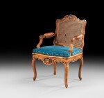 A carved beechwood fauteuil, French Régence, circa 1715 | Fauteuil à dossier plat en noyer sculpté d'époque Régence, vers 1715