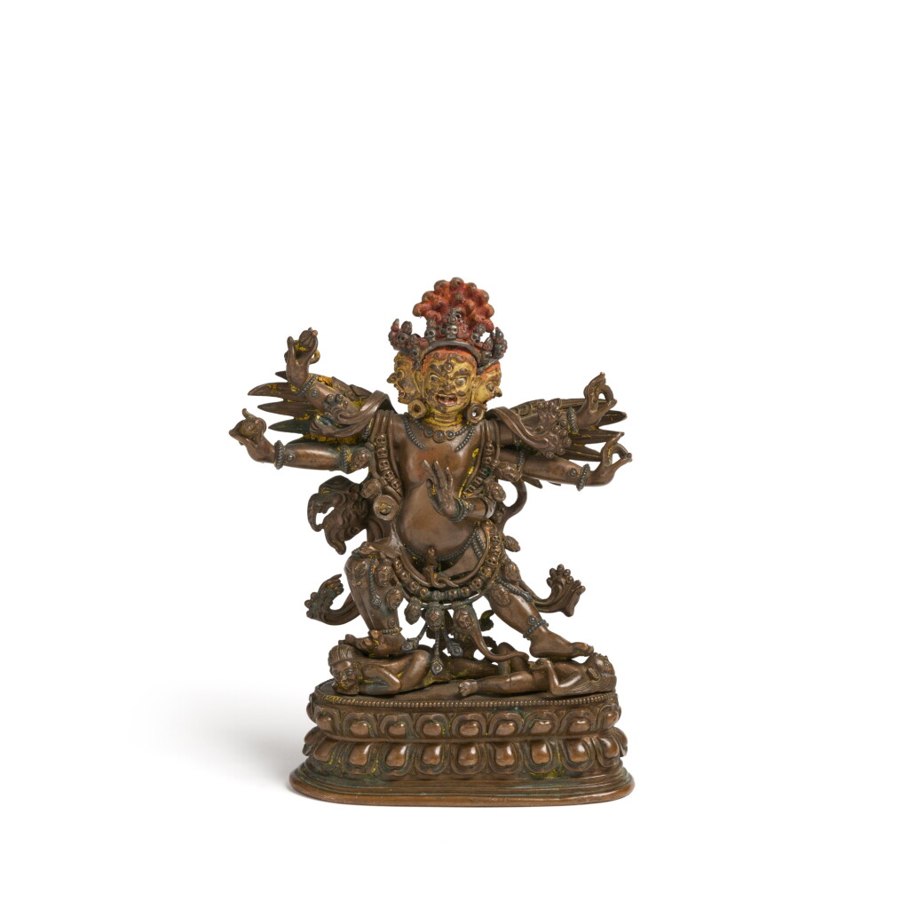 View full screen - View 1 of Lot 1099. A silver-inlaid copper-alloy figure of Vajrakilaya in the Pala style, Tibet, 18th century .
