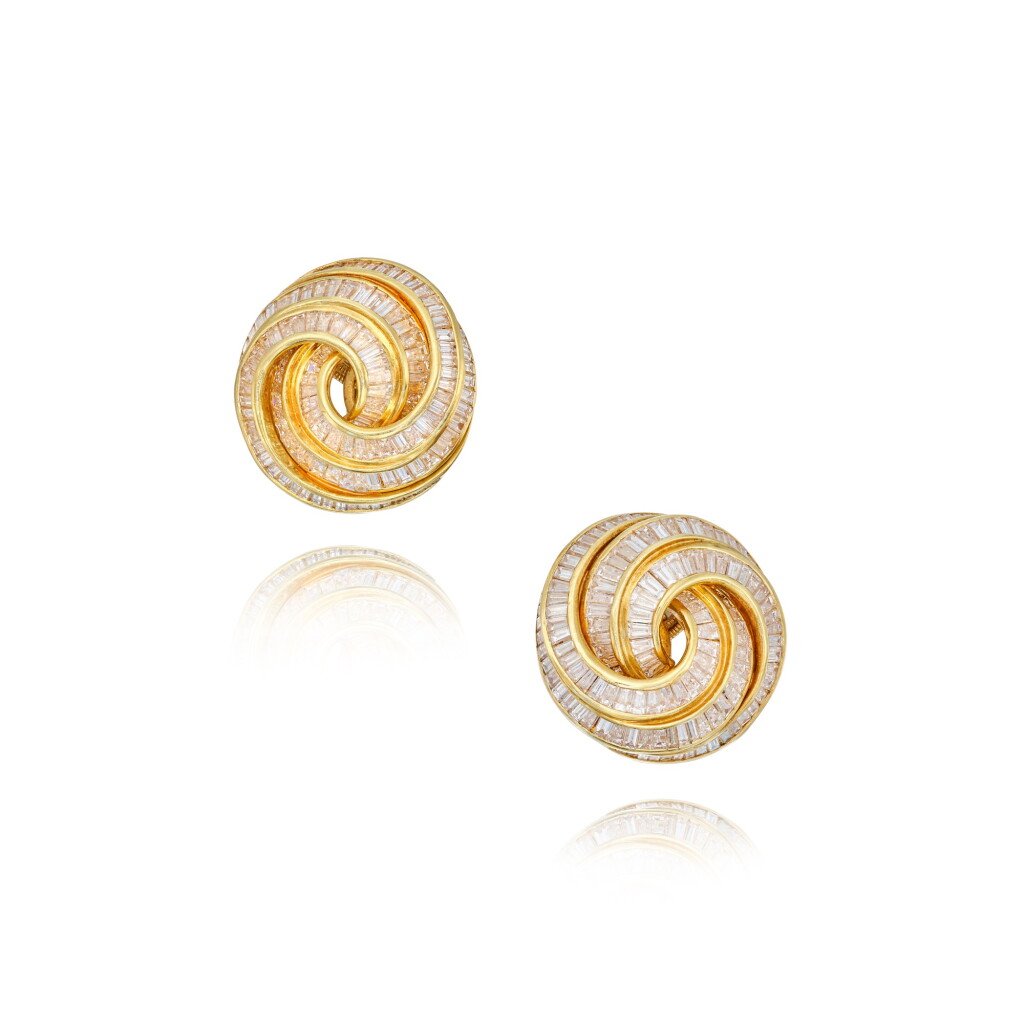 View full screen - View 1 of Lot 130. A Pair of Gold and Diamond Earclips.