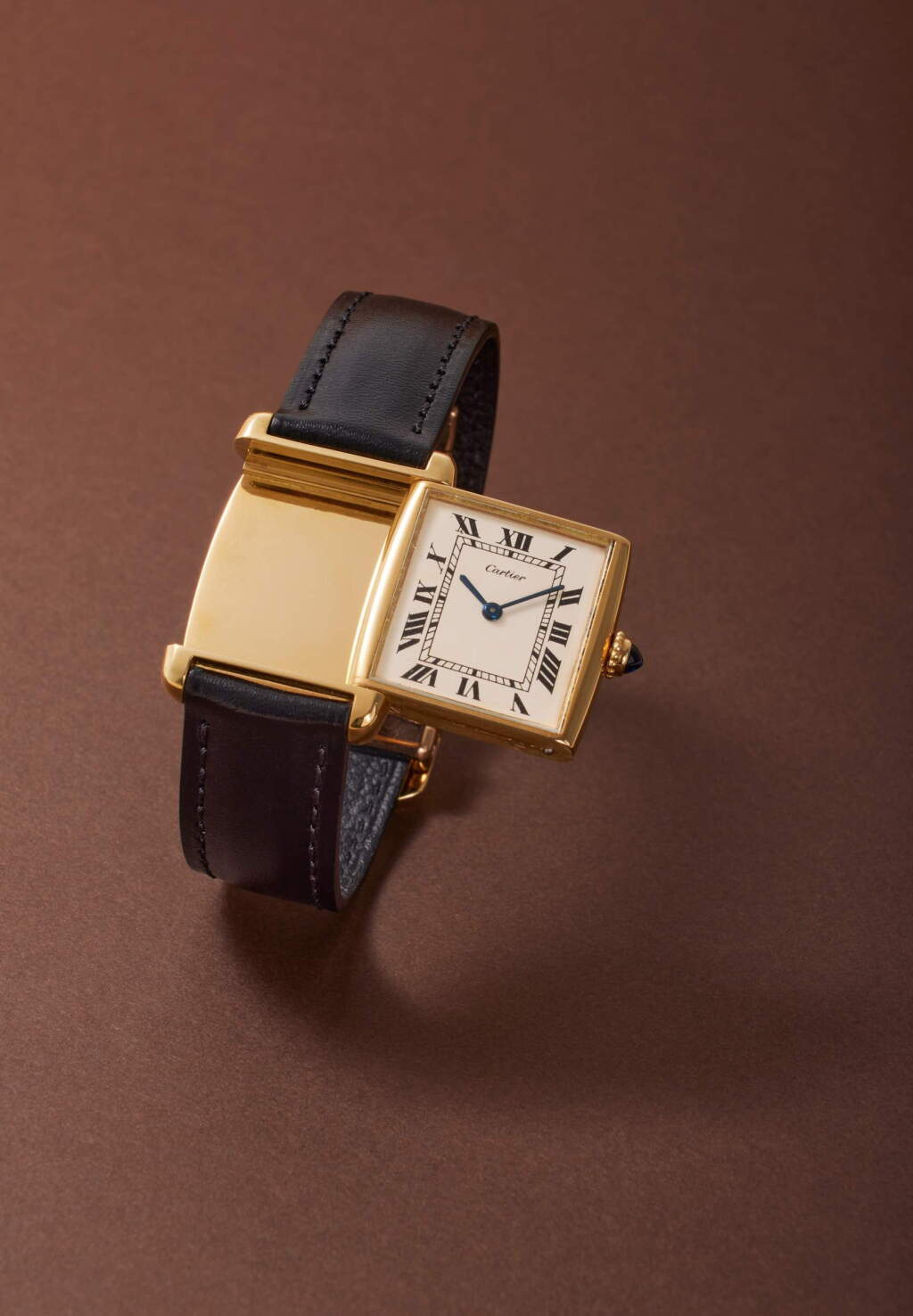 View full screen - View 1 of Lot 59. Tank Reversible | A rare yellow gold rectangular reversible wristwatch with original yellow and pink gold deployant buckle, Circa 1977.