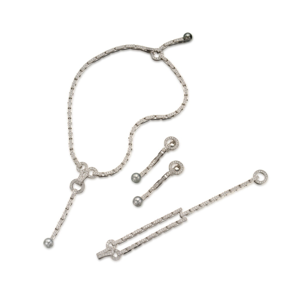 View full screen - View 1 of Lot 340. Diamond and Cultured Pearl 'Agrafe' Necklace, Bracelet and Pair of Earclips, France.