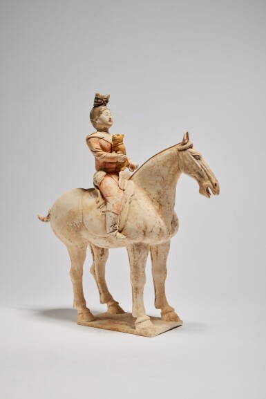 View full screen - View 1 of Lot 69. A Chinese Painted Pottery Figure of an Equestrian, Tang Dynasty | 唐 陶加彩騎馬俑.