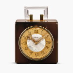 An agate, yellow gold, rock crystal and enamel 8-day desk clock with luminescent indexes, Circa 1926