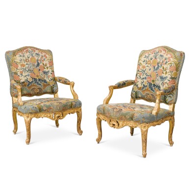 View full screen - View 1 of Lot 17. A pair of Régence carved giltwood fauteuils, circa 1720.