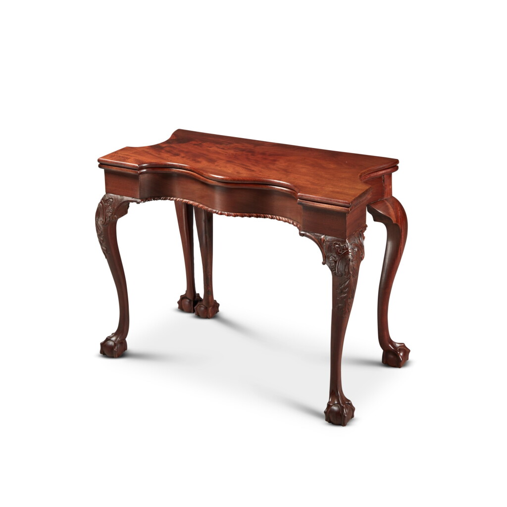 View full screen - View 1 of Lot 1519. Very Fine and Rare Chippendale Carved and Figured Mahogany Five-Leg Games Table, New York, Circa 1770.
