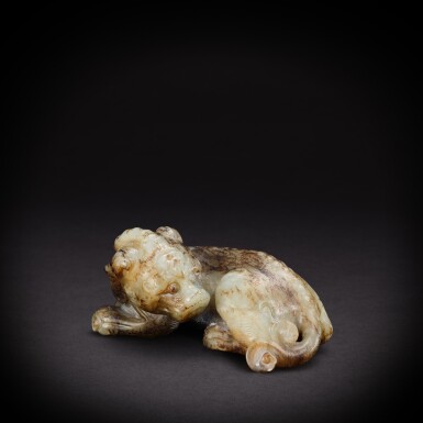 View full screen - View 1 of Lot 6874. A white jade recumbent mythical beast, Ming dynasty | 明 白玉瑞獸.