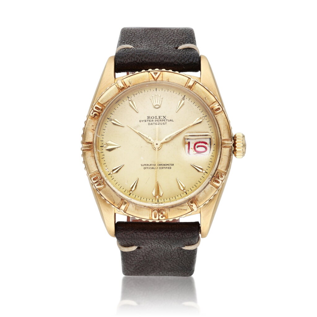 View full screen - View 1 of Lot 14. Reference 6609 Thunderbird | A yellow gold automatic wristwatch with roulette date wheel, Circa 1956.