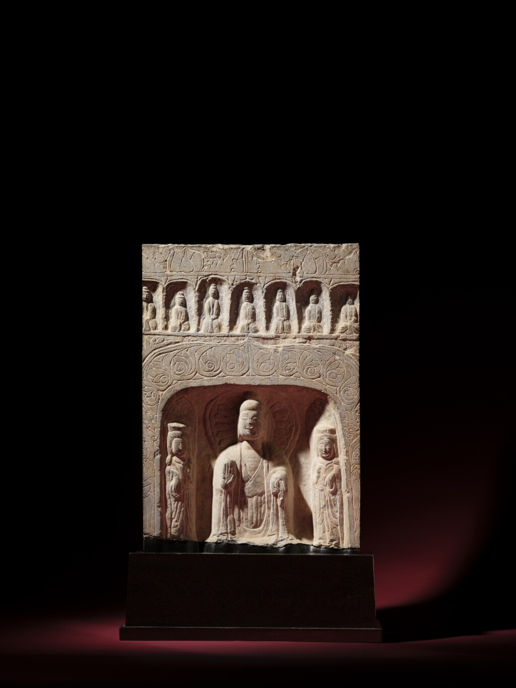 View full screen - View 1 of Lot 303. A limestone relief fragment of a Buddhist triad stele, Northern Wei dynasty | 北魏 石灰石雕三尊像龕.