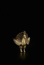A gilt-bronze figure of a peacock, Tibet or Nepal, 15th / 16th century