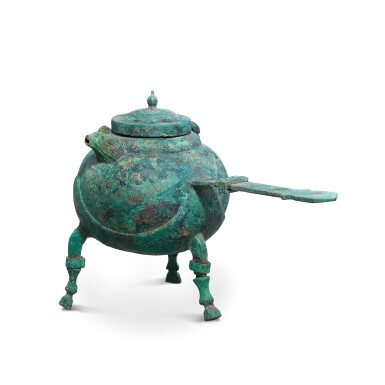 View full screen - View 1 of Lot 1065. A bronze tripod 'fish-dragon' pouring vessel, qiaodou, Eastern Han-Six dynasties | 東漢至六朝 青銅摺合式魚龍流口樵斗.