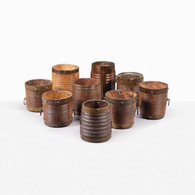 View full screen - View 1 of Lot 115. A collection of nine brass-bound rice measures, South India, 19th century | Ensemble de neuf mesures de riz en bois et laiton, Inde du Sud, XIXe siècle.