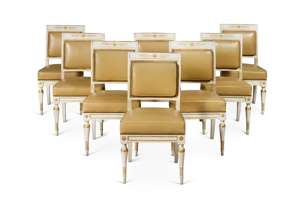 View full screen - View 1 of Lot 564. A Set of Eight Neoclassical Leather Upholstered Parcel-Gilt and Painted Side Chairs, Possibly South German, Circa 1835.