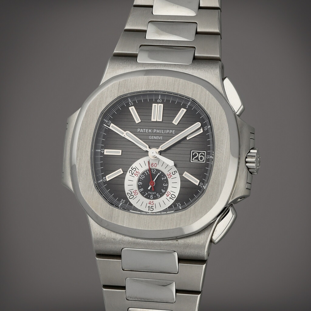 Voir en plein écran - Voir 1 du lot 30. Nautilus, Reference 5980/1A-014 A stainless steel flyback chronograph wristwatch with date and bracelet Circa 2012.