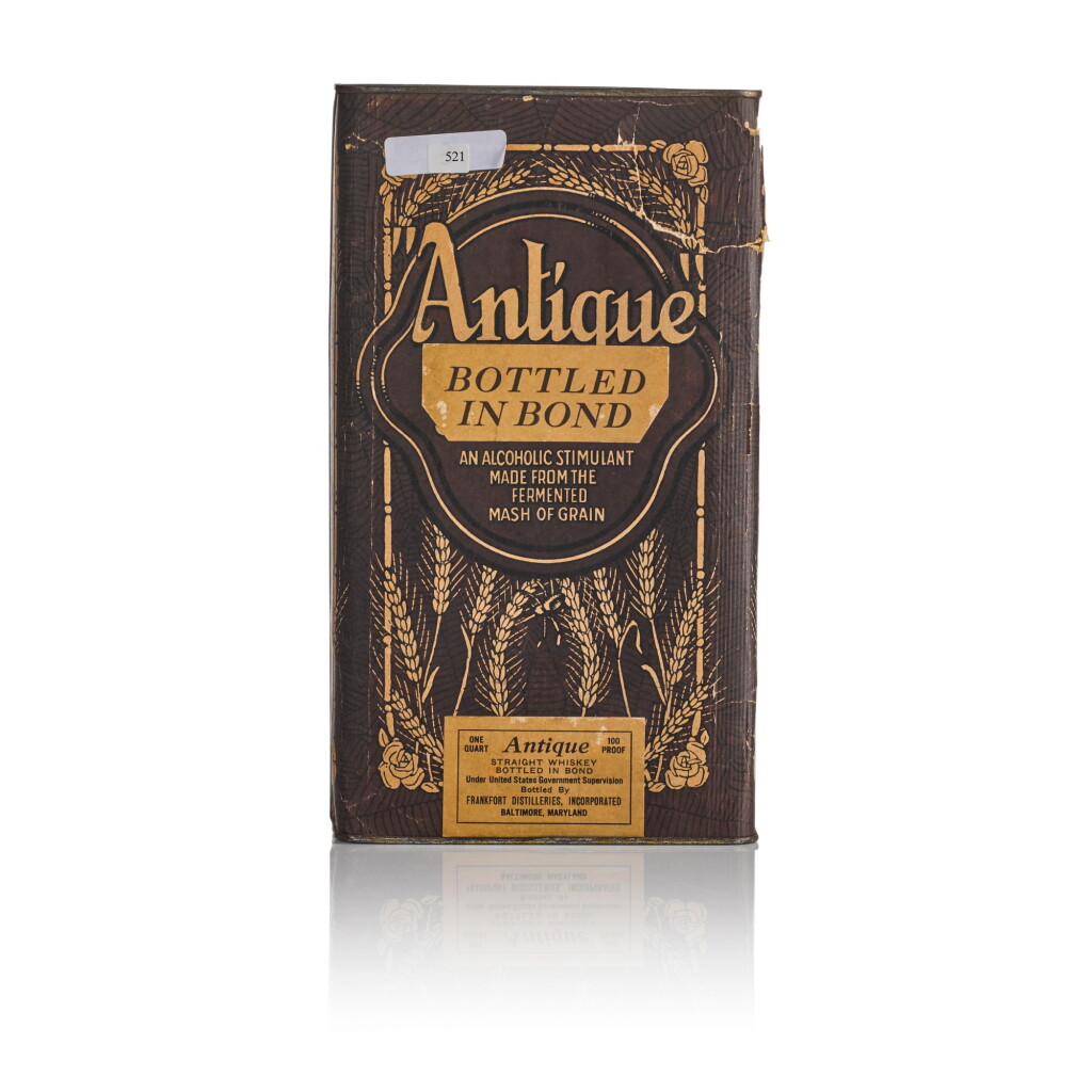 View full screen - View 1 of Lot 521. Antique Straight Whiskey 100 Proof 1917 (1 QTBT).