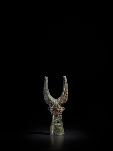 View full screen - View 1 of Lot 42. A bronze 'mythical beast' pole finial, Shang dynasty | 商 青銅獸面杖首.