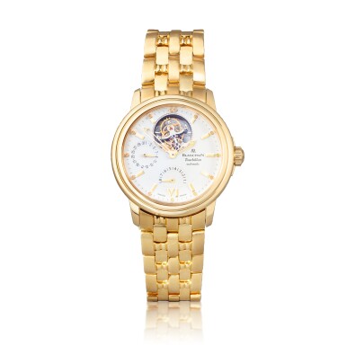 View full screen - View 1 of Lot 1057. Montre bracelet en or jaune avec jour, indication de réserve de marche, tourbillon et bracelet | Yellow gold tourbillon wristwatch with date, power reserve indication and bracelet Vers 1990 | Circa 1990.