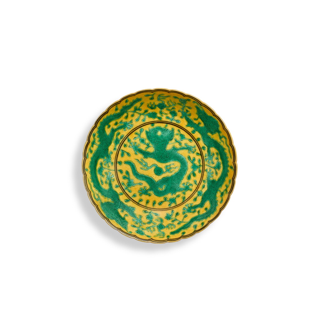 View full screen - View 1 of Lot 9311. A yellow-ground green-enamelled 'dragon' lobed dish, Seal mark and period of Qianlong | 清乾隆 黃地綠彩龍紋花口盤 《大清乾隆年製》款.