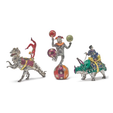 View full screen - View 1 of Lot 1849. DINOSAURS: A GROUP OF SILVER AND ENAMEL CIRCUS FIGURES, DESIGNED BY GENE MOORE FOR TIFFANY & CO., NEW YORK, CIRCA 1990.