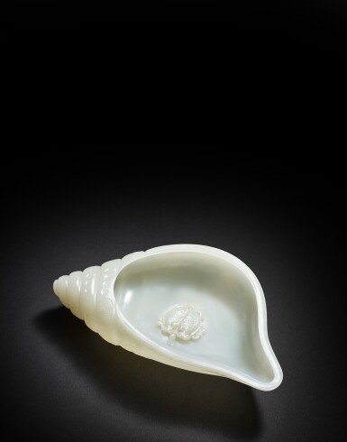 View full screen - View 1 of Lot 9878. A white jade 'bajixiang' conch-form cup, Qing dynasty, 18th century | 清十八世紀 白玉雕八寶海螺水丞.