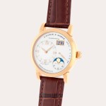 Lange 1 Moonphase, Reference 109.032 | A yellow gold wristwatch with digital date display, moon phases and power reserve indication | Circa 2012