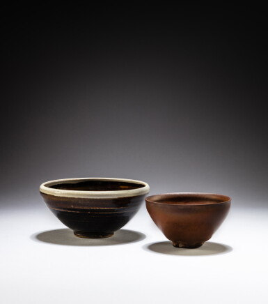 View full screen - View 1 of Lot 30. A ‘Jian’ russet-brown glazed bowl and a Henan black-glazed russet-splashed bowl, Song - Jin dynasty | 宋至金 河南窰黑釉醬斑盌.