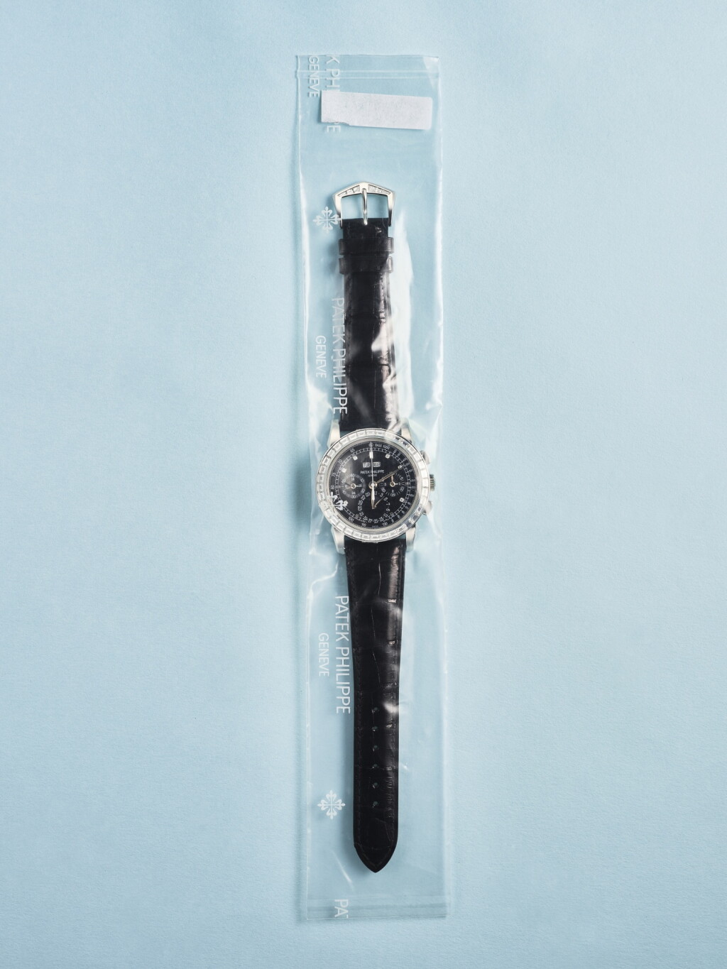 View full screen - View 1 of Lot 2415. Reference 5971 | A platinum and diamond-set perpetual calendar chronograph wristwatch with moon phases, 24 hour and leap year indication, in single factory seal, Circa 2007.