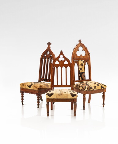 View full screen - View 1 of Lot 121. A set of three French and English Neogothic walnut, Rio rosewood, Rio rosewood veneer and mahogany veneer armchairs, circa 1840.